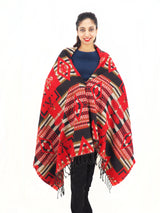 a woman wearing a red and black poncho