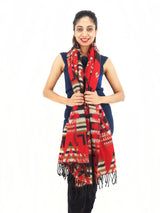 a woman wearing a red scarf and black boots