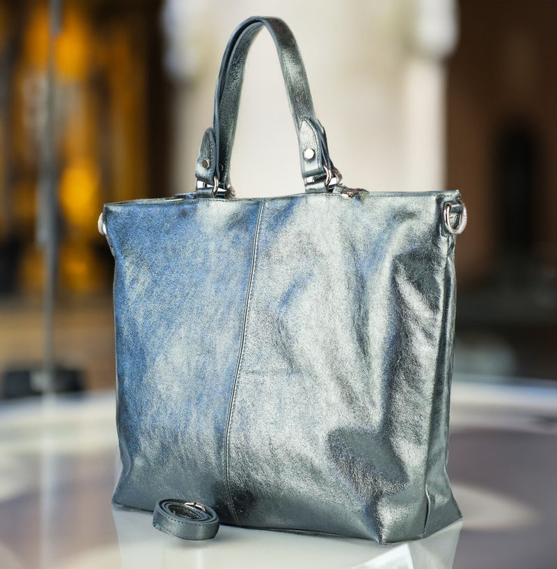 Metallic silver leather handbag on display, stylish design