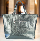 Back view of metallic silver handbag with zipper pocket