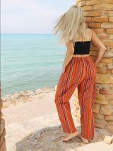 Multi-color boho pants near ocean