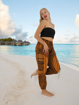 a woman standing on a beach next to the ocean