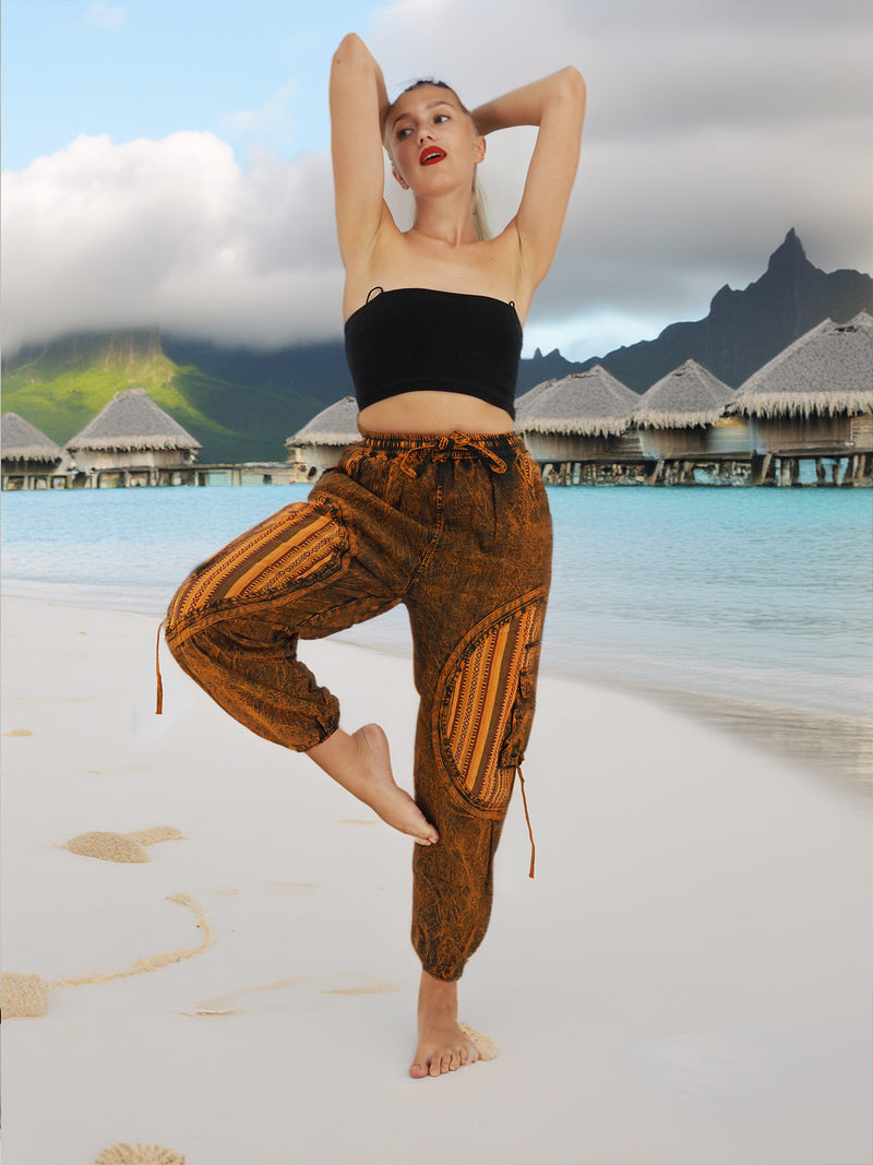 a woman is doing a yoga pose on the beach