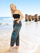 Unisex boho yoga pants with blue patterns by ocean