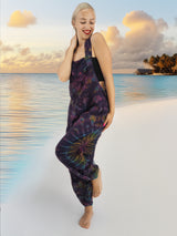 a woman standing on a beach next to the ocean