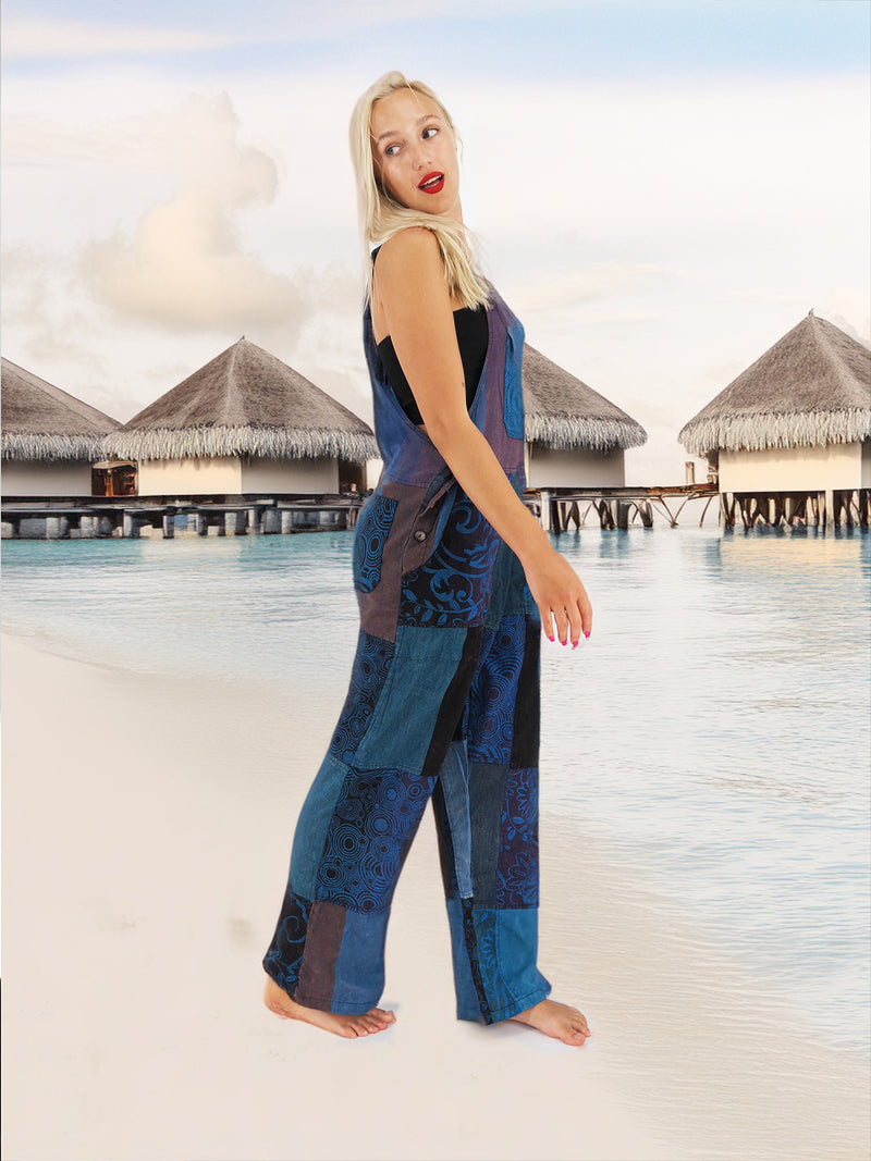 a woman standing on a beach next to a body of water