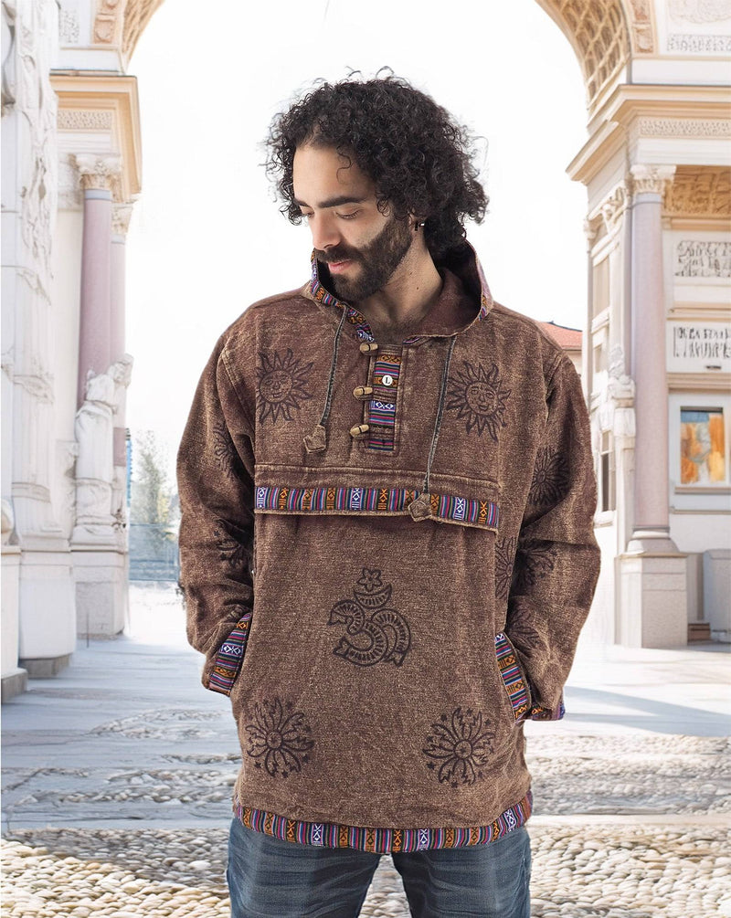 a man with a beard wearing a brown shirt