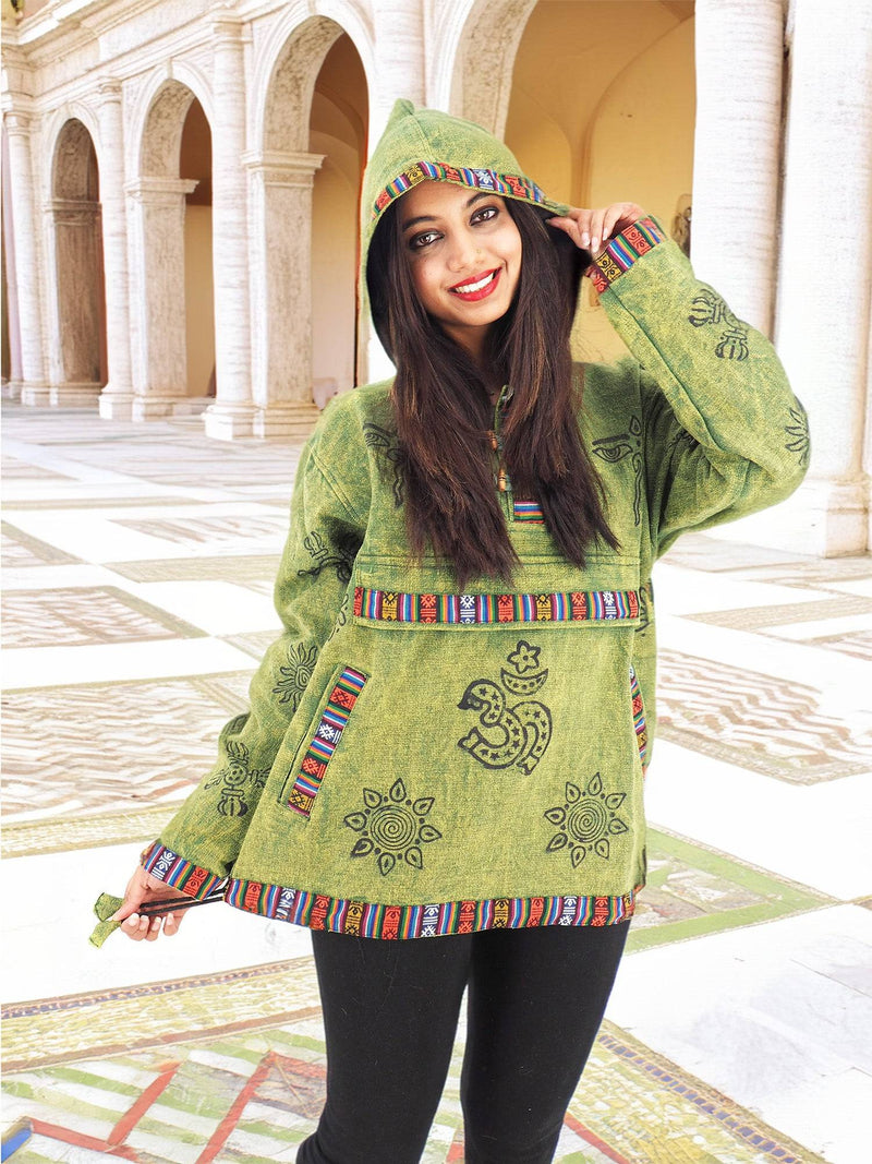 a woman in a green hoodie posing for a picture