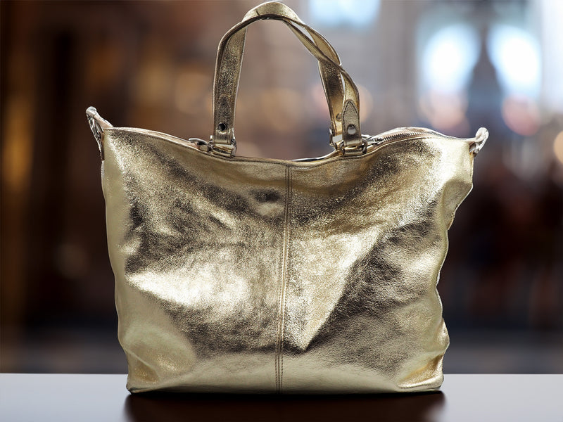 Metallic gold leather handbag on display