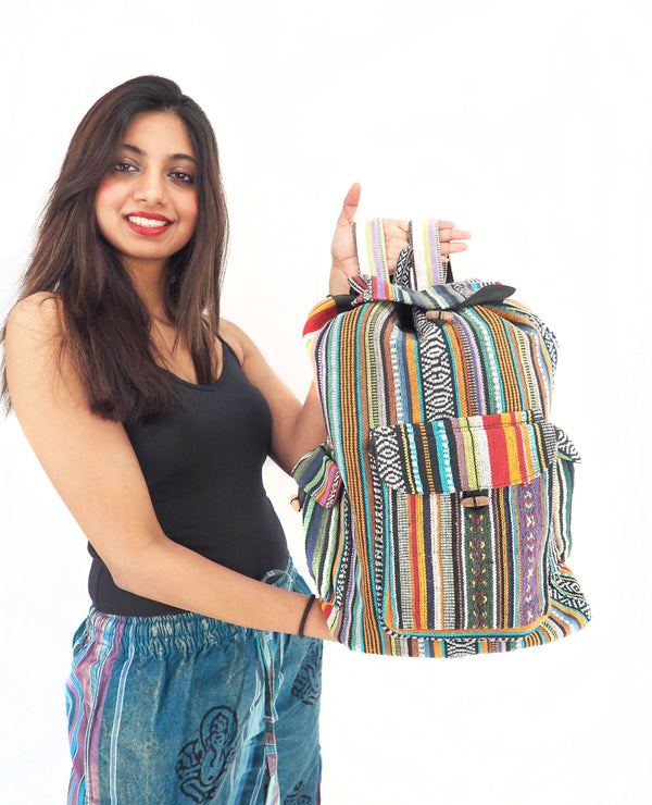 Vibrant bohemian backpack, handmade cotton and hemp, featuring colorful striped patterns, perfect for everyday style or travel.